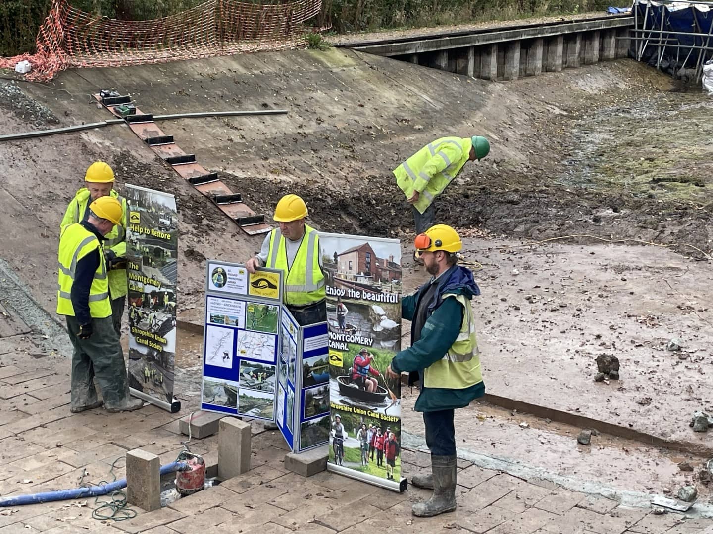 People working with The Rollaway in the background